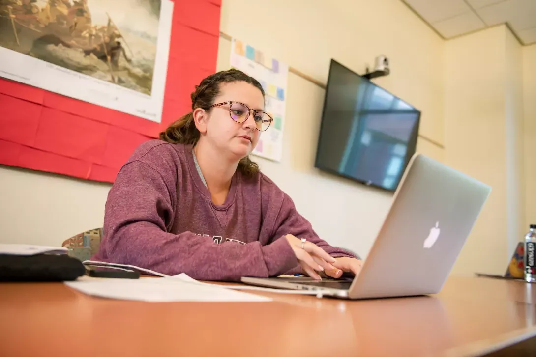 Principal licensure student on her computer